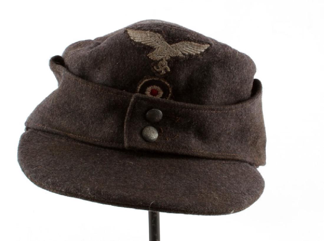 WWII THIRD REICH LUFTWAFFE M43 CAP W/ CLOTH EAGLE: A grey wool Luftwaffe cap with embroidered eagle. About size 57. Some wear to liner as photographed.