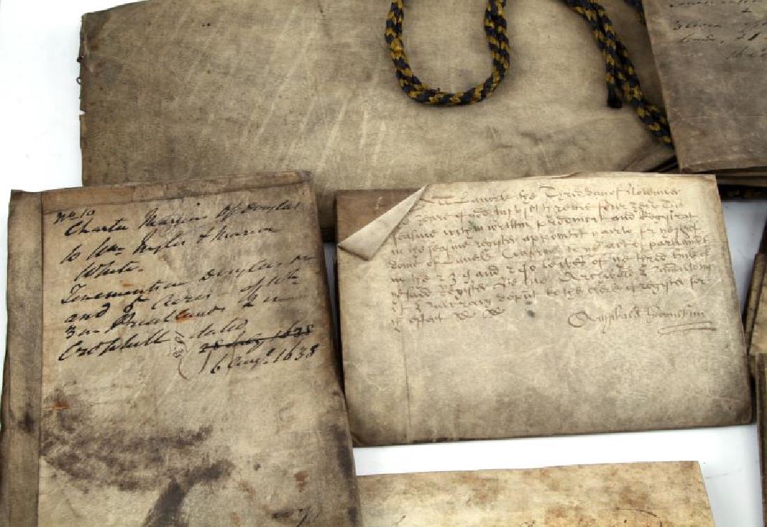 15TH C CASTLE DOUGLAS SHEEP SKIN VELLUM DOCUMENTS: One paper and ten vellum documents from Castle Douglas, a town in Dumfries and Galloway, Scotland, dating from 1634 to 1776. Includes land deeds and a charter; seven of the documents are in Latin, fou