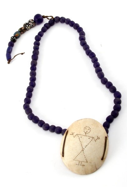 24 INCH COBALT BLUE TRADE BEADS 18TH CENTURY: Museum quality 24" cobalt blue trade beads with 3 inch engraved bone Gorget from 1700s. Unauthenticated, sold as is.