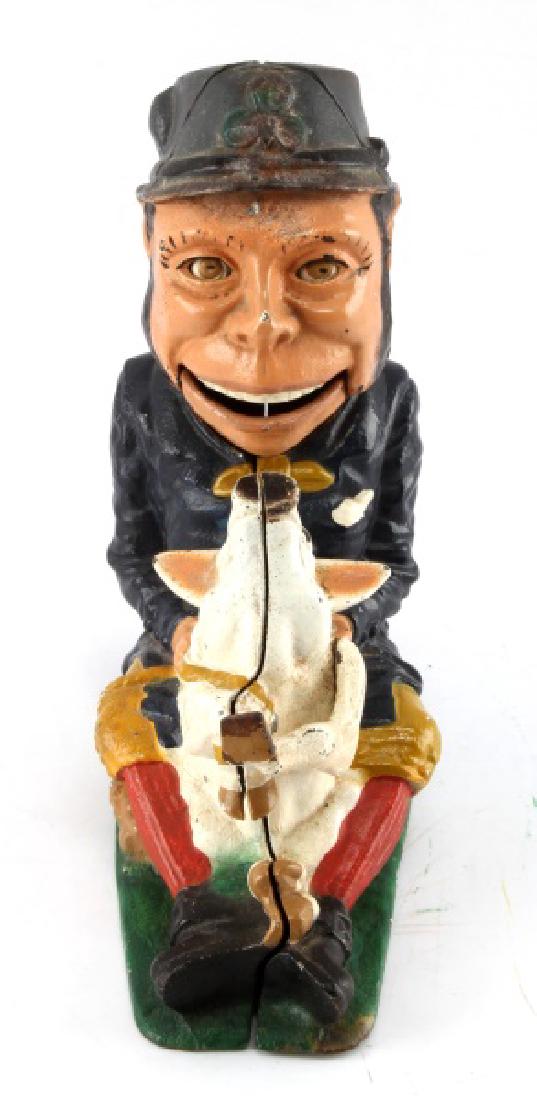 BOOK OF KNOWLEDGE REPRO CAST IRON PIGGY BANK: Book of Knowledge reproduction cast iron piggy bank man. In working condition. Light chips of the paint on exterior shell. Weighs 6 lbs. 7 x 3.5 x 8 inches.