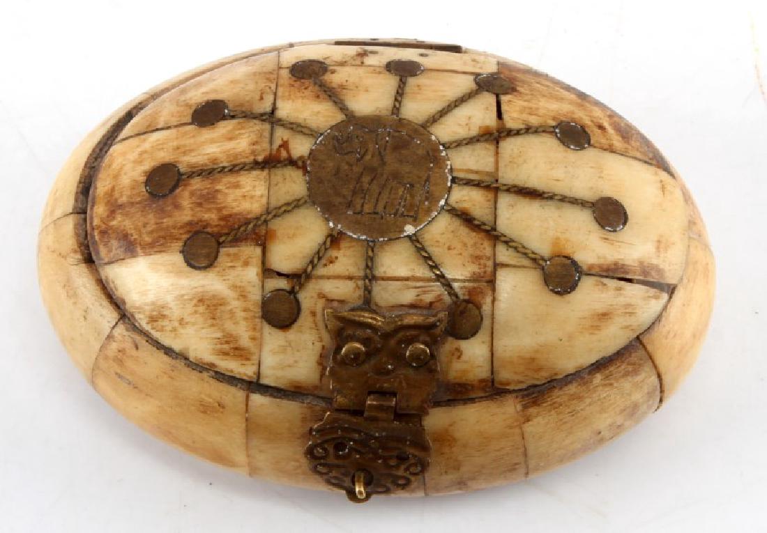 SMALL BONE PILL OR JEWELRY BOX WITH CLASP: Unmarked and has a latched opening. Measures approximately 4" across and 1" tall. In good condition; fabric on the inside is beginning to peel off.