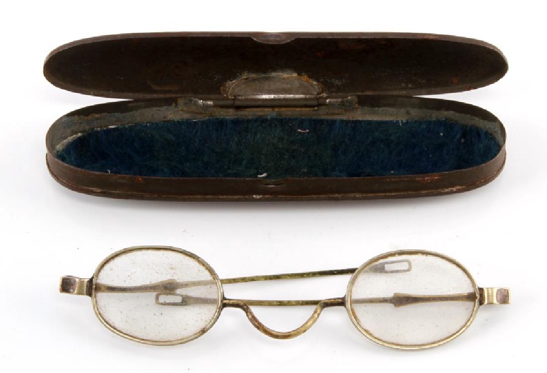 CIVIL WAR ERA EYEGLASSES W PARKERS PATENT CASE: Civil War era Eyeglasses with Parkers Patent 1860 case. No manufactures marks on either item. Felt on inside of case missing at the top. Glasses are in good condition with light scratches on the lens.