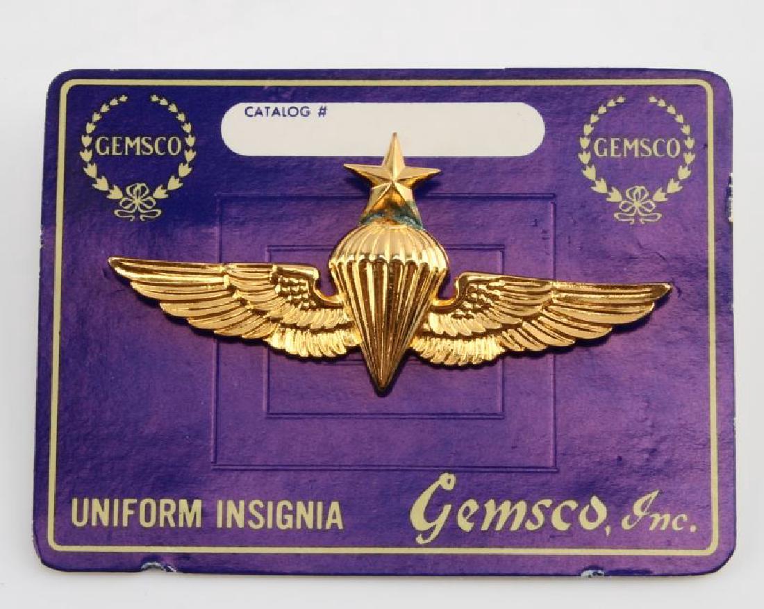VIETNAM WAR USMC USN SENIOR PARATROOPER JUMP WING: A Vietnam War era US Marines and/or Navy Senior Paratrooper Jump Wings measuring 2-3/4 inches wide by 1-5/16 inches tall. The badge has two clutch post mounts on the reverse and the mark "6-22-N," and