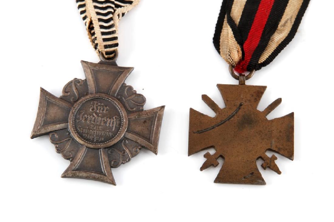WWI GERMAN HINDENBURG CROSS & PRUSSIA MERIT CROSS: German Hindenburg Cross and Prussia Merit Cross. German Hindenburg cross features a red, black, and white ribbon. Stamped with the maker mark "L NBG". Prussia Merit Cross features large silvered metal