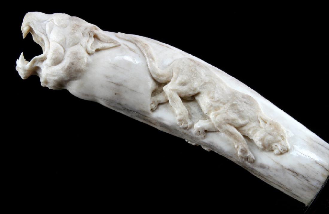 VINTAGE PANTHER CARVED BONE HANDLE DAMASCUS BOWIE: Superb craftsmanship, unsigned, age indeterminate. Blade length is 9 inches, overall 15 inches and is near mint. Some age discoloration to grip.