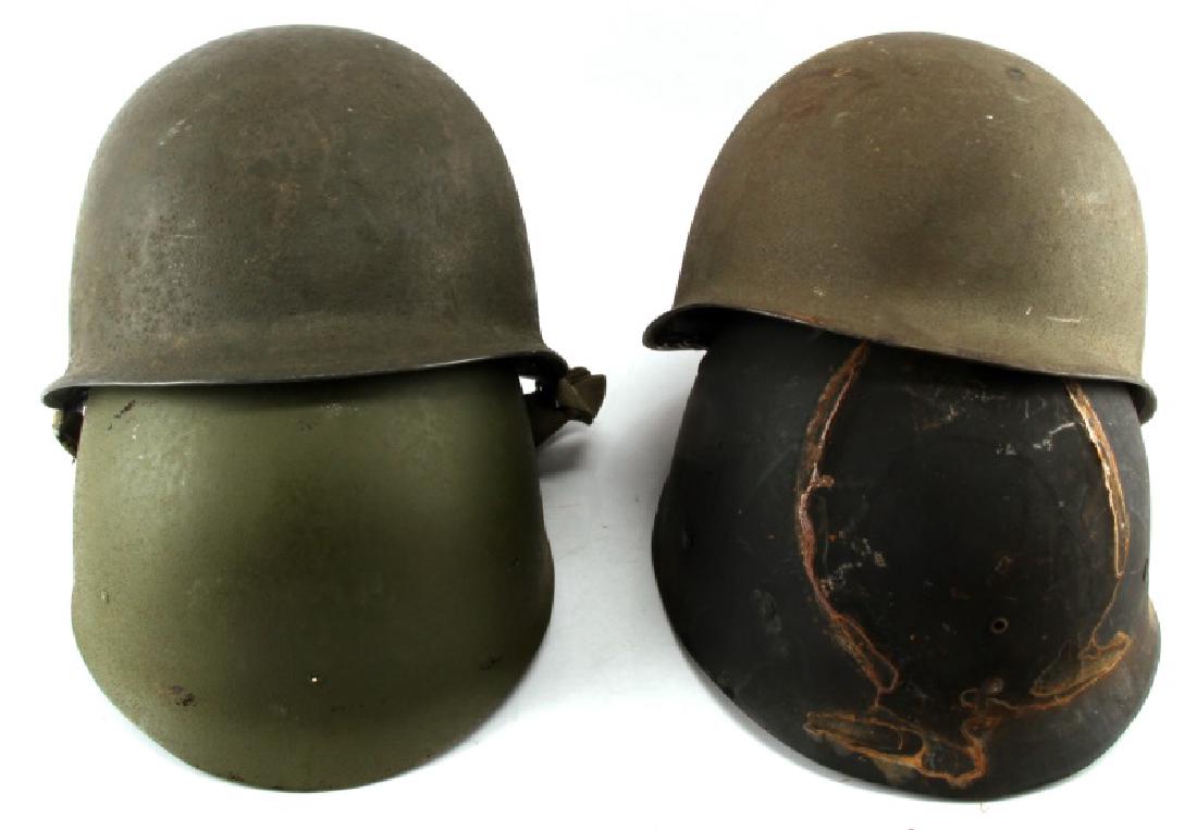 LOT OF 2 VIETNAM ERA US ARMY M1 COMBAT HELMETS: Both include chin strip and inner webbing but neither has outer camo cover.. First is marked capac in a cross. The name Col. Davidson is written on the inner webbing. 2nd is marked M1 X.