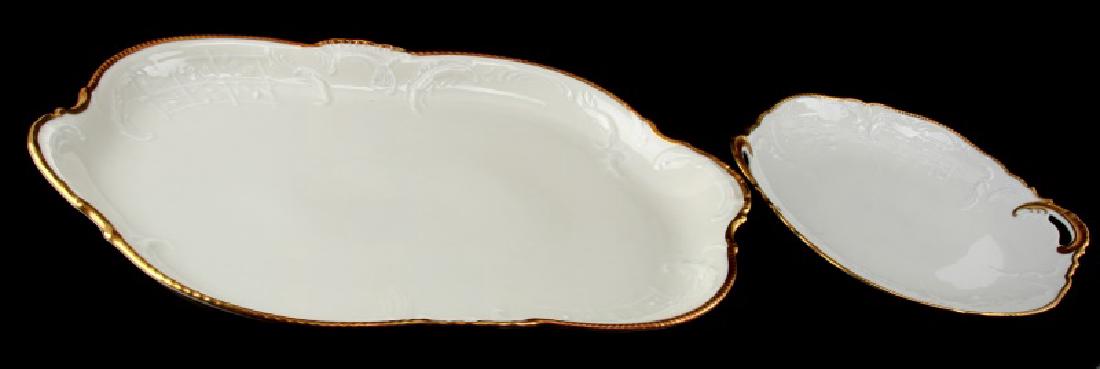 LOT ROSENTHAL CLASSIC GERMANY SANSSOUCI PLATTERS: Lot of two Rosenthal classic Germany platters, gold trim, Sanssouci ivory pattern china. Large one measures 19 1/2"x12". Small one measures 12"x10 1/2". A few small surface scratches on the large one.