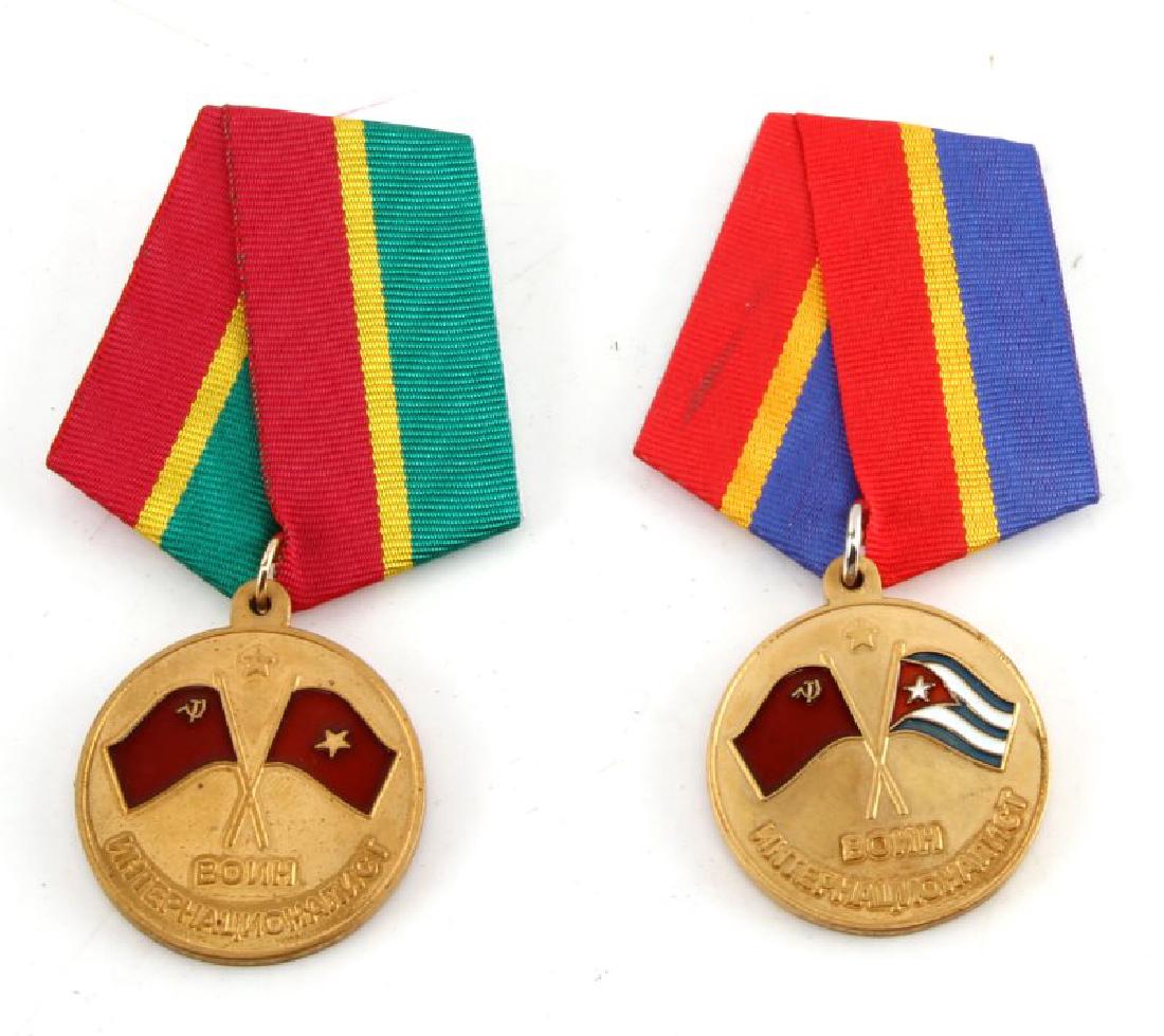 LOT OF 2 RUSSIAN MEDALS VIETNAM & BAY OF PIGS: Lot of 2 Russian medals issued for participation of foreign affairs. One is for the Cuban, Bay of Pigs, which reads, "To the participant of Protection of the Cuban Revolution. 1962." The other, for th