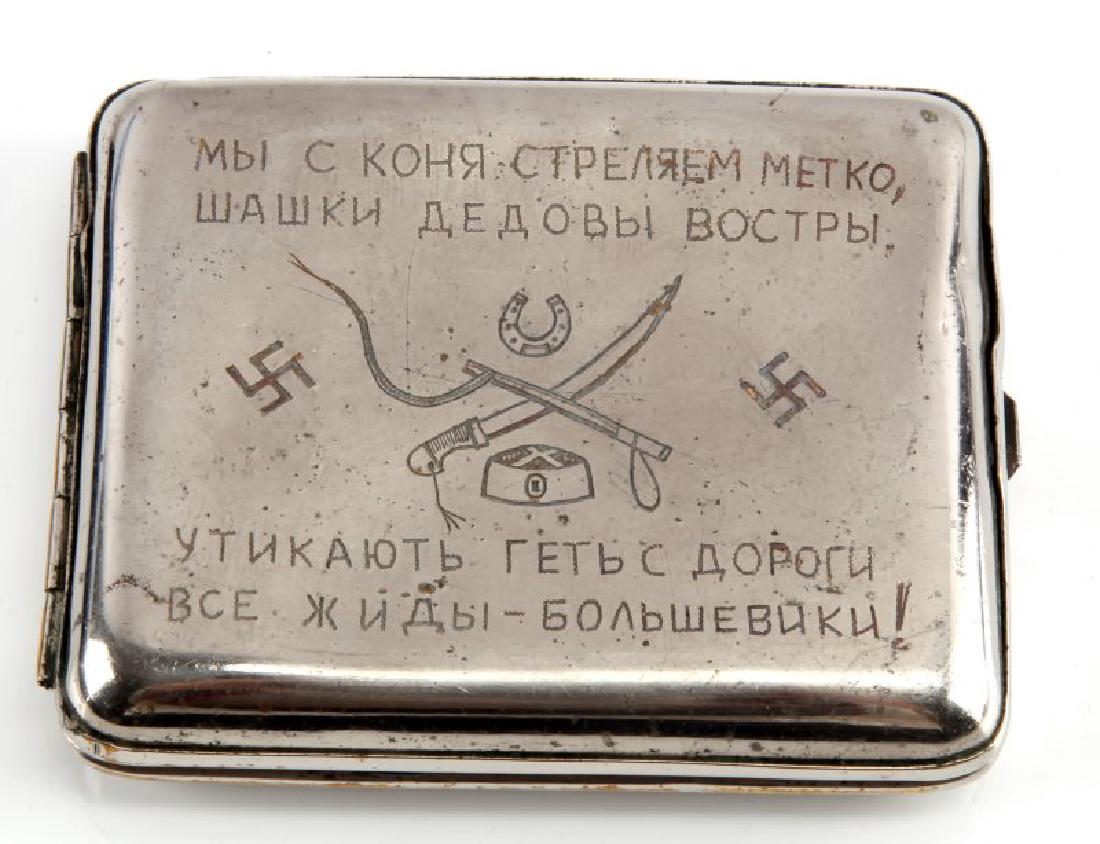 RUSSIAN COSSACKS CIGARETTE CASE ANTI-SEMITIC: Russian Cossacks cigarette case has anti-Semitic and anti-Bolshevik poetry engraved on one side, along with swastikas, a horseshoe, a hat, and some weapons. The other side is engraved with a skull and