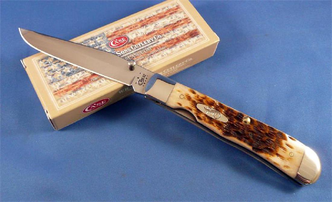 CASE XX CUTLERY 30024 AMBER TRAPPERLOCK KNIFE: One Case 30024, new in box. Stock photo used.