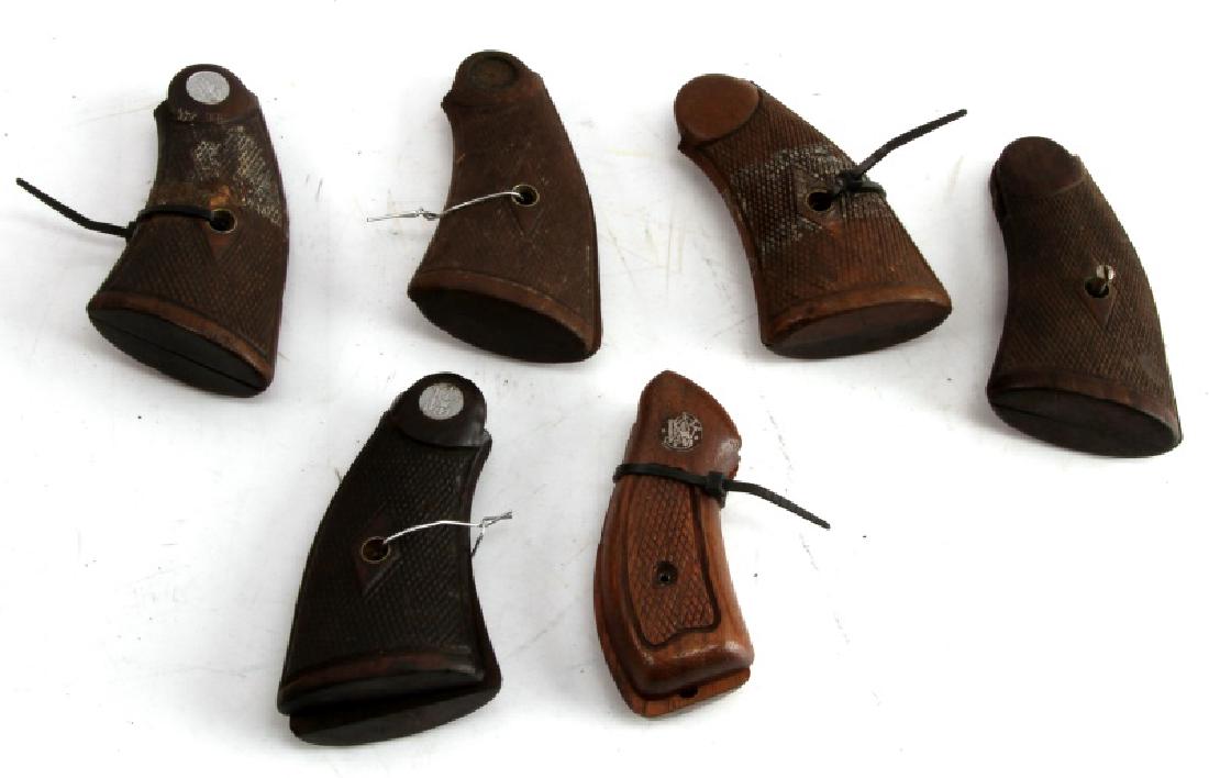 LOT OF SMITH & WESSON DOUBLE ACTION REVOLVER GRIPS: Lot of five Smith & Wesson double action revolver grips, all wood, varying frame size.