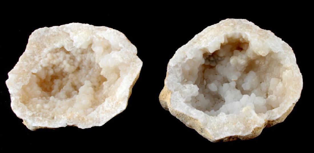 2 WHITE CALCITE GEODES GEM STONES FROM EX DEALER: Two calcite geodes. Measure between 5 and 6 inches across. Good collector condition.