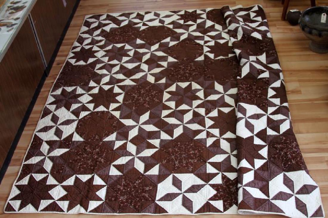 VINTAGE HANDMADE COTTON QUILT BROWN CREAM KING: Vintage King size handmade quilt. Brown and cream color with little peach colored floral pattern. Geometric shapes, cream color backside. Some staining, but no rips, tears, or holes. Measures 87 by 87