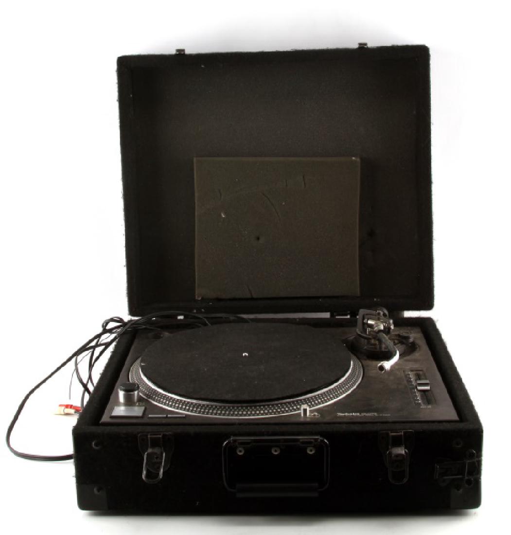 TECHNICS SL1210MK2 TURNTABLE IN CASE: Back clamp on case is broken, but works when front latches are closed. Needle is absent. Dust cover is absent. Powered on and tested with both rpms. Overall in good to very good condition with light c