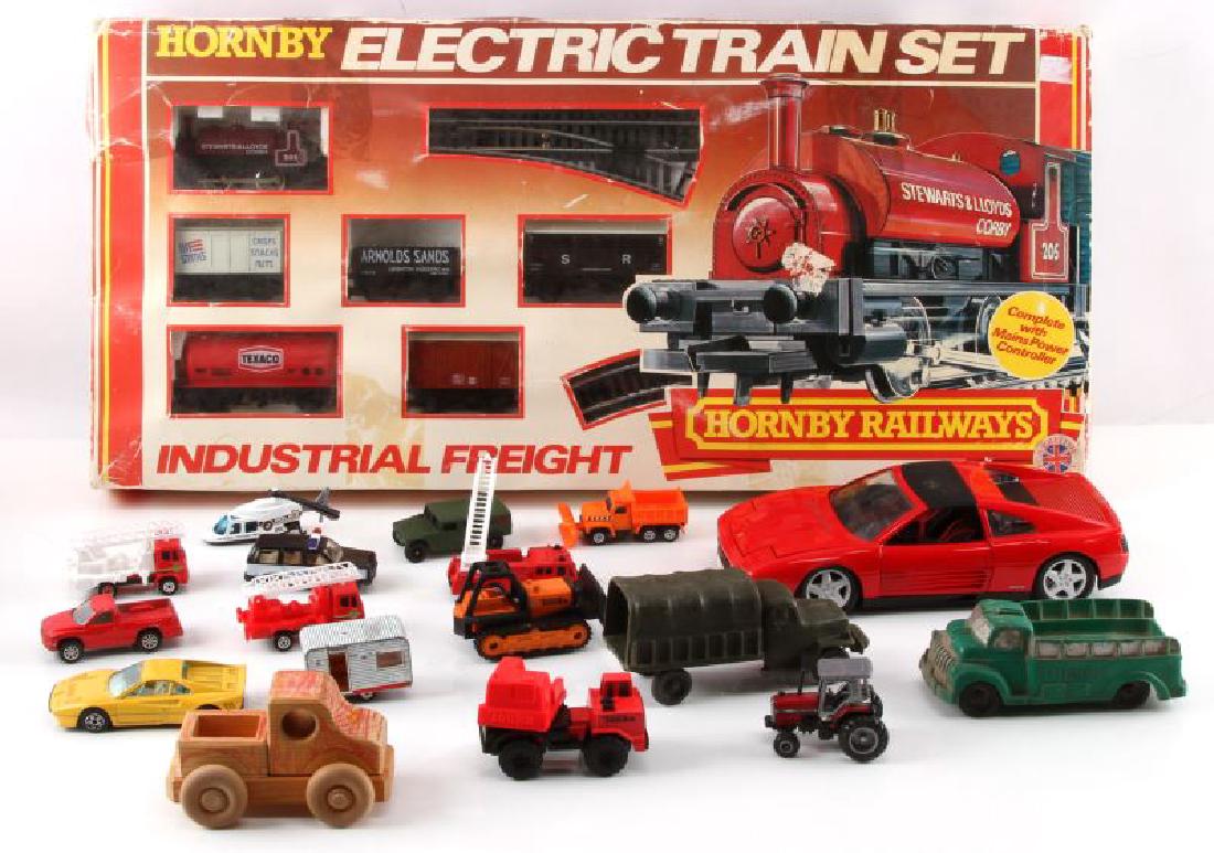 TOY LOT HORNBY ELECTRIC TRAIN SET HASBRO MAISTO: Toy lot includes: 1) 1982 (?) Hornby Electric Train Set in box - unsure if complete, 2) Maisto 1:18 scale Ferrari 348 TS, and 3) small bag of Matchbox-style 1:64 scale cars (camper, fire engines, poli