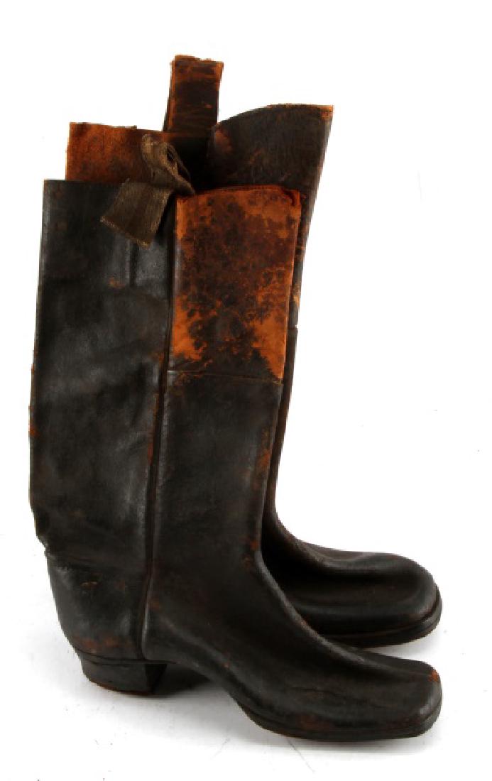 ANTIQUE PAIR CIVIL WAR USA DRUMMER BOYS BOOTS: One pair of Civil War boots for drummer boy. Item is in good condition, but has some moderate at top, whereas bottom of boot is very good. One has replacement tab at the top.