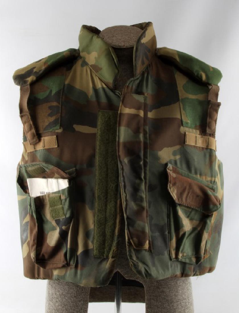 US ARMY BODY ARMOR FLAK JACKET SHRAPNEL FRAG VEST: XL from 45" and upward. Older model does not have pockets for kevlar plates like the newer ones do. Good condition but has some dirt spots and marker writing on it. Comes with army issue use and care