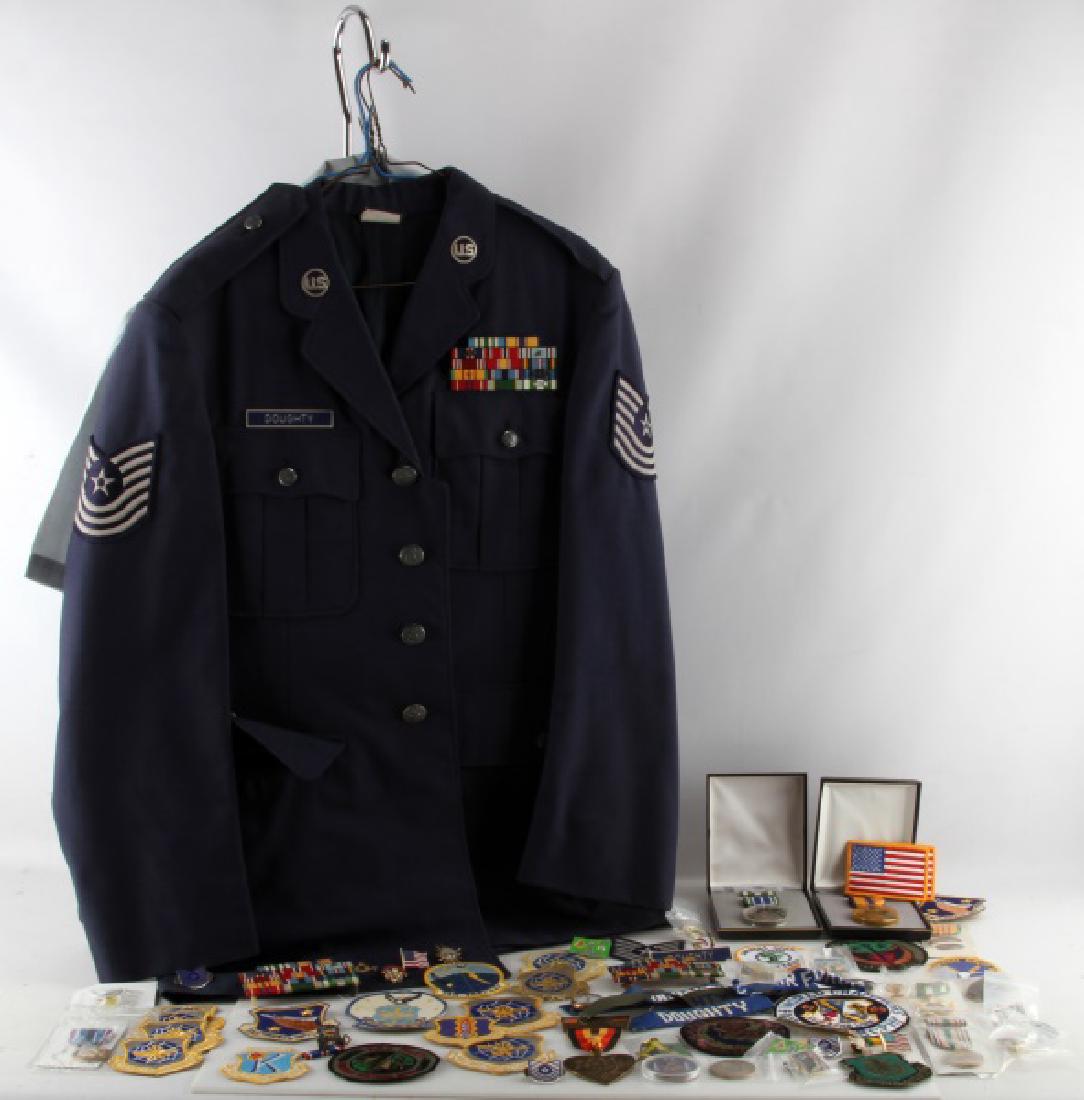 VIETNAM ERA USAF AIR FORCE VETERAN UNIFORM & MEDAL: Includes 2 enlisted uniforms, several ribbon racks, patches of all sorts, non working Elgin pocket watch, 5 medals including Vietnam appreciation, challenge coins 1983 German running medal, Masonic it