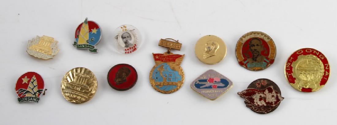 VINTAGE LOT 12 NORTH VIETNAM PINS SAN SANG ETC: Vintage lot of twelve (12) pins range in size from approx .75" - 1.25". San Sang, Pyongyang, and more. Pins in good condition.