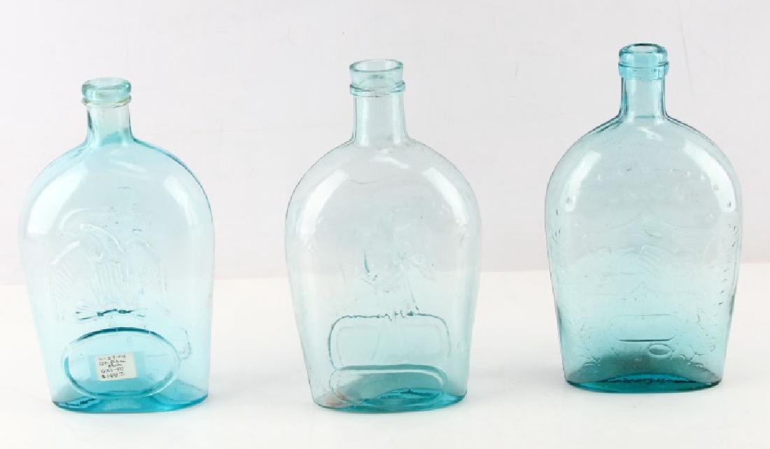 3 19TH CEN AQUA UNION GLASS BOTTLES CLASPED PIKES: Three 19th Century hand-blown aqua Union glass bottles. One says "Union" with clasped hands, eagle and "E.Worm's ER&C Pittsburgh" to other side. One Pike's Peak quart with eagle to one side and man wi