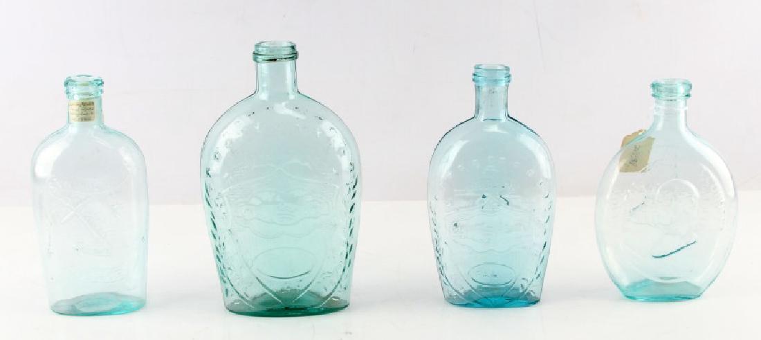 19TH CEN UNION GLASS AQUA BOTTLES FLASKS LOT OF 4: Lot of 4 Union glass bottles. One Washington and General Taylor with ground pontil (just under 7.5 inches), one 1860 Springgarden Glassworks with log cabin, ground pontil (just under 8 inches), one Un