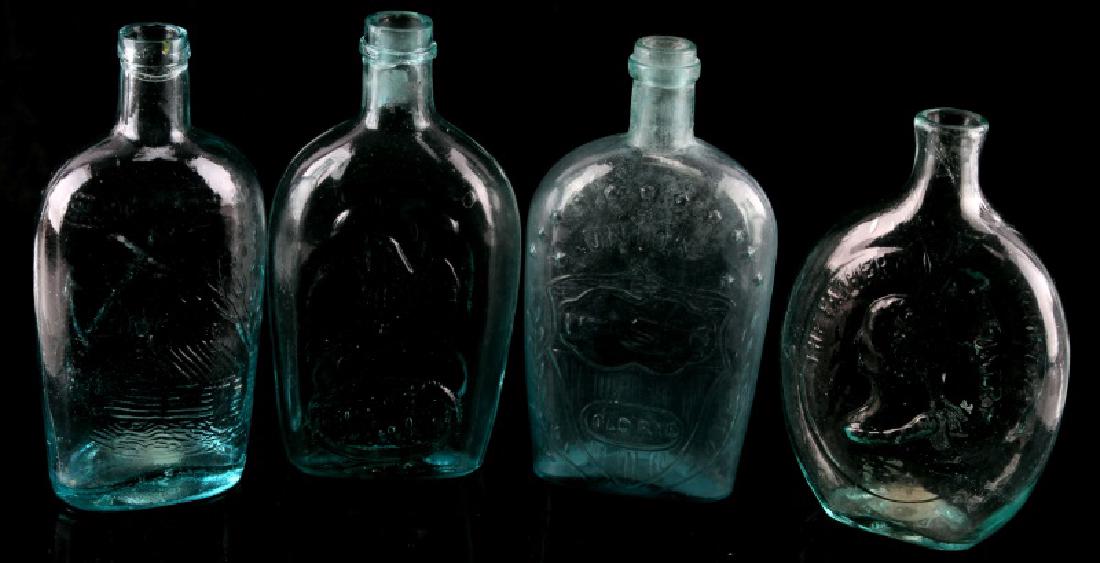 LOT 4 ANTIQUE BACK BAR BOTTLES SPRING GARDEN ETC: Lot of four (4) 19th Century glass flasks/bottles. "General Taylor Never Surrenders/The Father of His Country" - approx. .5" chip out of front, "Union & Eagle Pittsburgh Old Rye" - heavy wear, "Spring