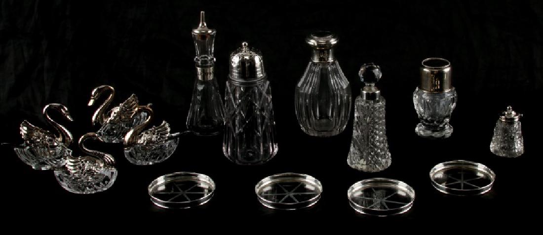 STERLING CUT GLASS LOT BOTTLE SALT PEPPER COASTER: Sterling silver and cut glass bottle lot. Includes: early 1900's hallmarked pepper box (Broadway or Belway & Co.), C.R. & Co. perfume bottle, bulbous perfume bottle (marked with star and 7H), perfume