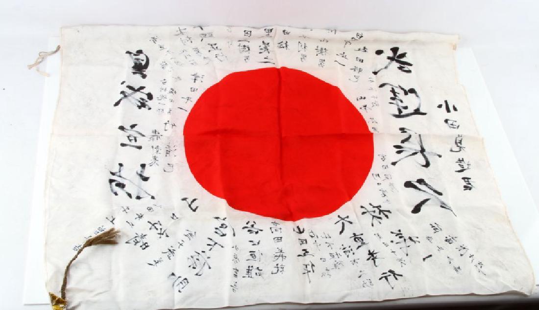 WWII JAPANESE MEATBALL PERSONAL BATTLE FLAG SIGNED: WWII era Japanese "Meatball" flag marked with various Japanese characters which could either be prayers or signatures by the soldier's friends & family. Attached to one grommet of the flag is what app