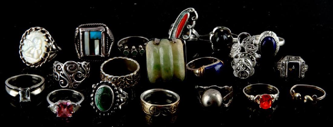 LOT OF 20 STERLING SILVER ARTESIAN CRAFTED RINGS: Grouping of 20 Sterling Silver Artesian Crafted marked silver rings. Including gemstones such as : Turquoise, Lapis Lazuli, Mexican Soapstone, Onyx, and Mother Of Pearl. Overall in excellent condition
