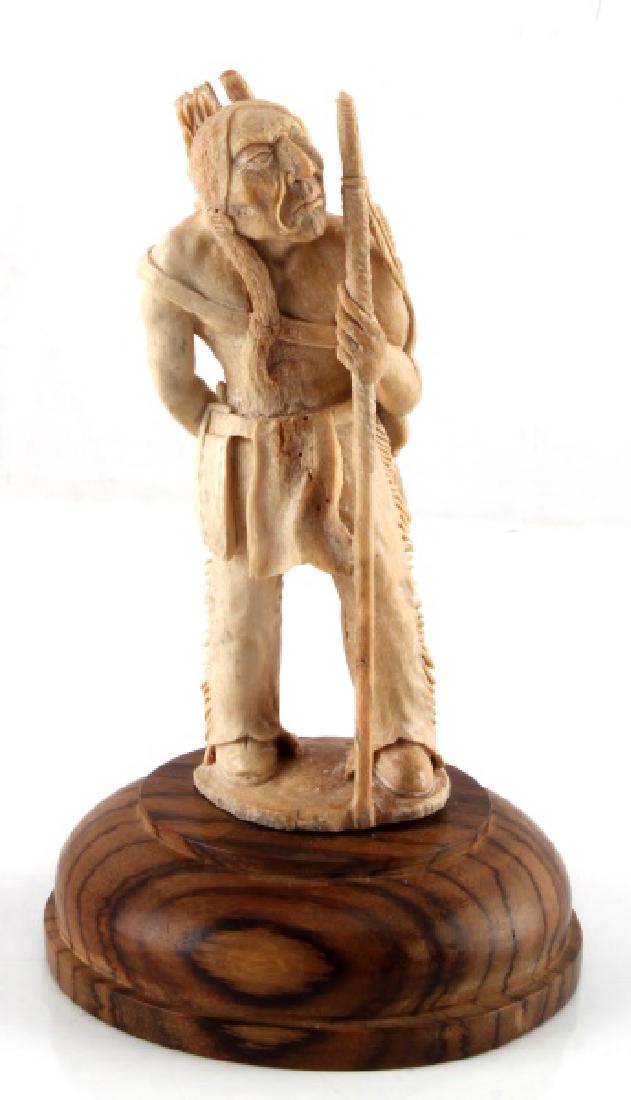 FOSSIL BONE PLAINS INDIAN 6.5 INCH SCULPTURE: With stand measures 8 inches. Old warrior with Bow and arrows in quiver, unsigned excellent detail.
