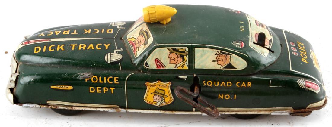 ANTIQUE DICK TRACY WIND UP POLICE CAR TIN TOY: Antique tin toy wind-up Dick Tracy police car. Some rust, dings, and paint loss. Car is completely intact, but doesn't seem to work. Good display condition.