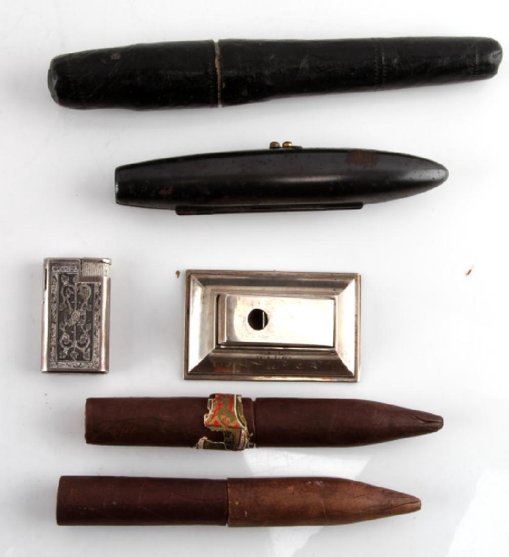 LOT 6 CIGAR AND CHEROOT HOLDERS W LIGHTER & CUTTER: Lot includes: two (2) 5 1/2" tobacco leaf rolled "torpedo" single cheroot holders (with inner glass tubes), one (1) 7 1/4" paper mache single cigar holder, one (1) hinged metal "torpedo" single cigar 