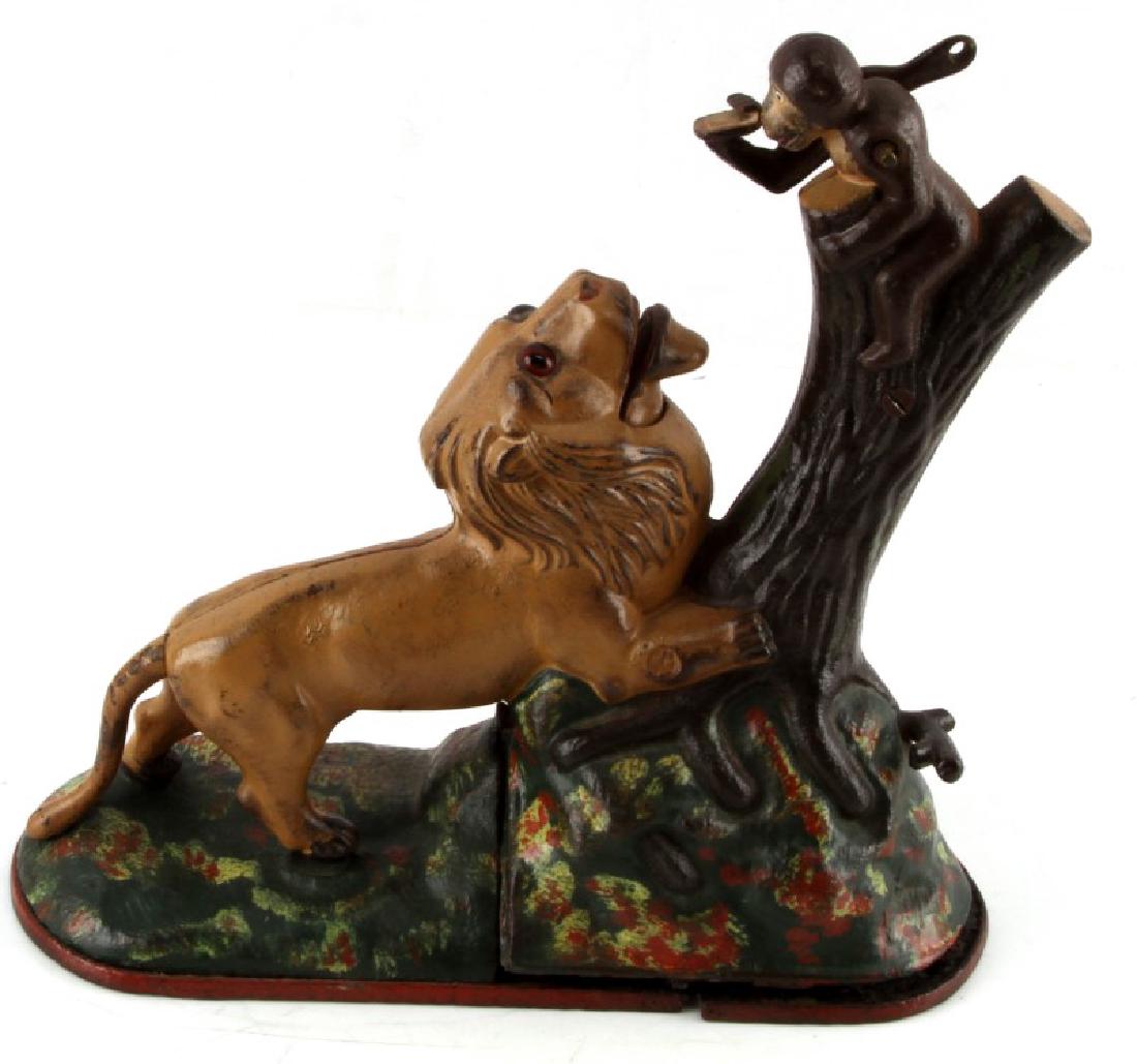ANTIQUE C 1883 IRON LION & MONKEY MECHANICAL BANK: Made by Kyser & Rex of Philadelphia circa 1883. Cast Iron. Fair condition. Smaller monkey is detached, and bottom of bank is broken. May be missing internal pieces and require some fixes.