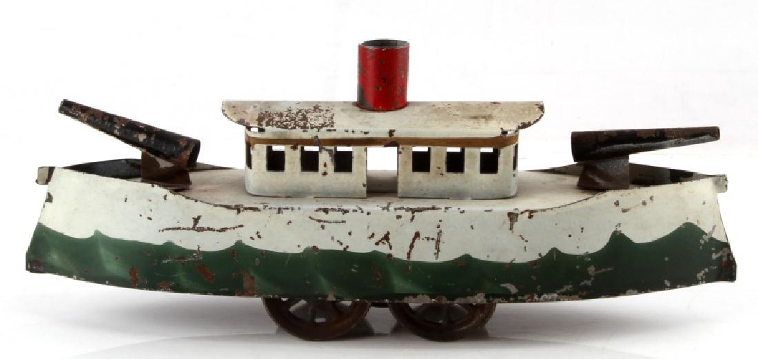 ANTIQUE TIN ARMY BOAT TOY FEATUING CANNONS: Antique tin army boat toy featuring cannons. Has minor paint lose. In relatively good condition. Maker unknown. Measures 11" in length and 2 1/2" wide.