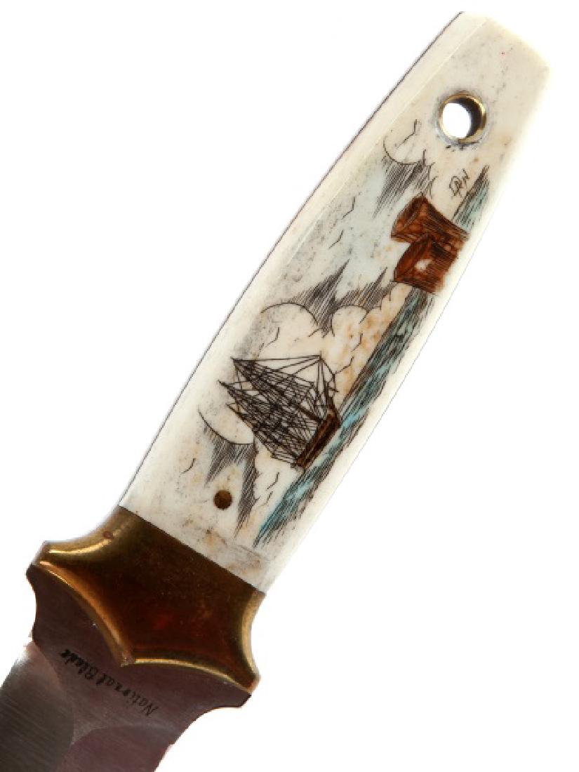 NATIONAL BLADE SIGNED SCRIMSHAW BONE HANDLE KNIFE: Sailing vessel on one side Lighthouse scene on reverse, signed on the ship side. Marked 6A Quality Steel Japan on one side, and "Assasin" on the other. Measures overall just over 7 inches. Please acqu
