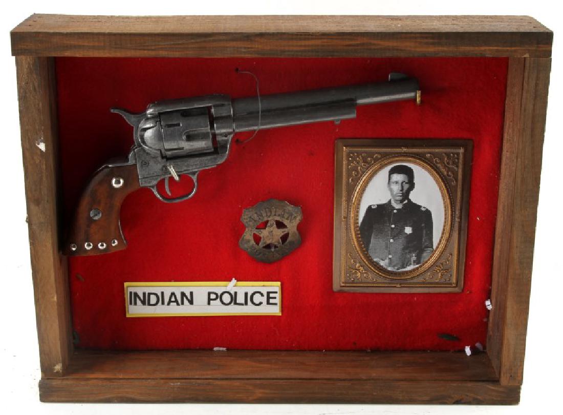 INDIAN POLICE DISPLAY WITH REPLICA REVOLVER: Indian Police display with badge, picture, and replica revolver. Comes in wooden frame that measures 12 3/4" by 16 3/8" by 3 1/4".