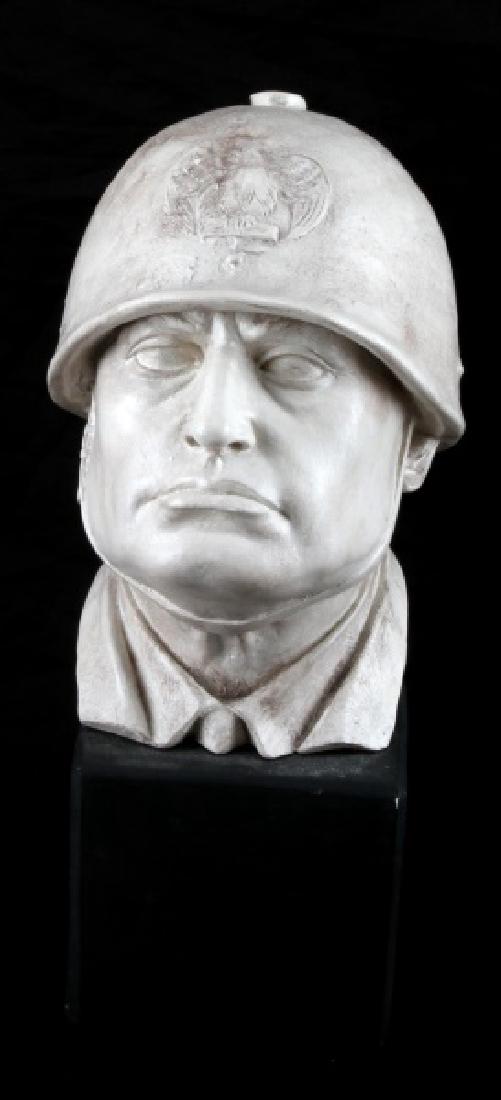 MUSSOLINI BUST WITH GENERAL HELMET HARD PLASTER: Heavy hard plaster bust of Mussolini with generals helmet and chin up in the air. Small size. Measures 11" tall, 6 1/2" deep, and 5" wide. reverse features artists signature. This lot has a reserve.