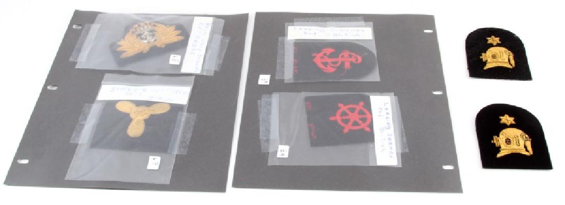 6 WWII ROYAL NAVY PATCHES FOR DIVER OFFICER SEAMAN: 6 WWII Royal Navy patches. Includes Leading Seaman in Red, Leading Helmsman in red, Royal Navy Officer's Cap Badge, Stoker 2nd Class Gold, and Ship's Diver 4yr Service Patch in Gold (2). All in very g