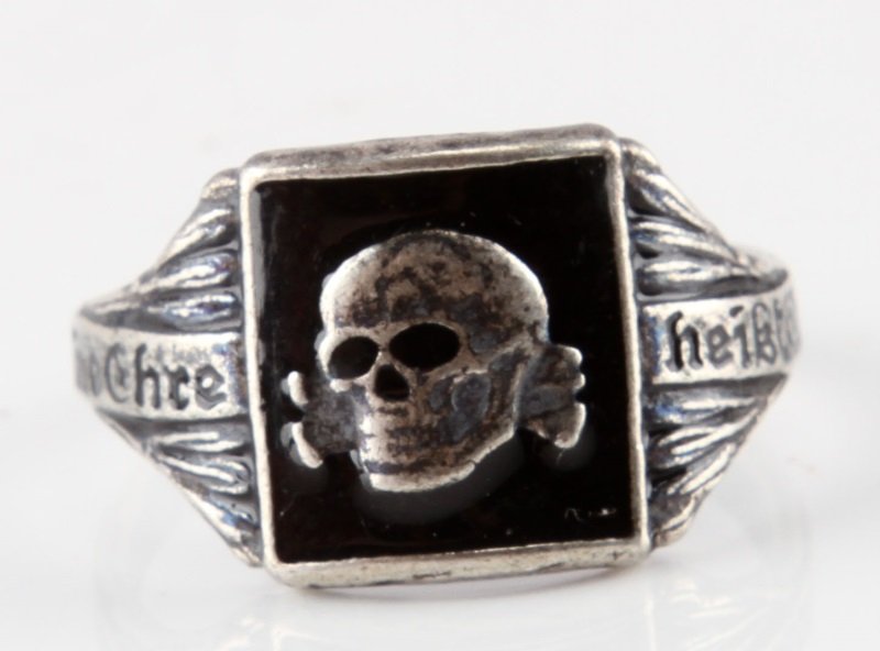 GERMAN WWII WAFFEN SS PANZER TOTENKOPF SILVER RING: Size 10 1/2 silver ring with image of soldier on front and "DUX" on both sides. Light wear/some discoloration present. Maker's mark to bottom of band. Very good condition. Unauthenticated. Sold "as is