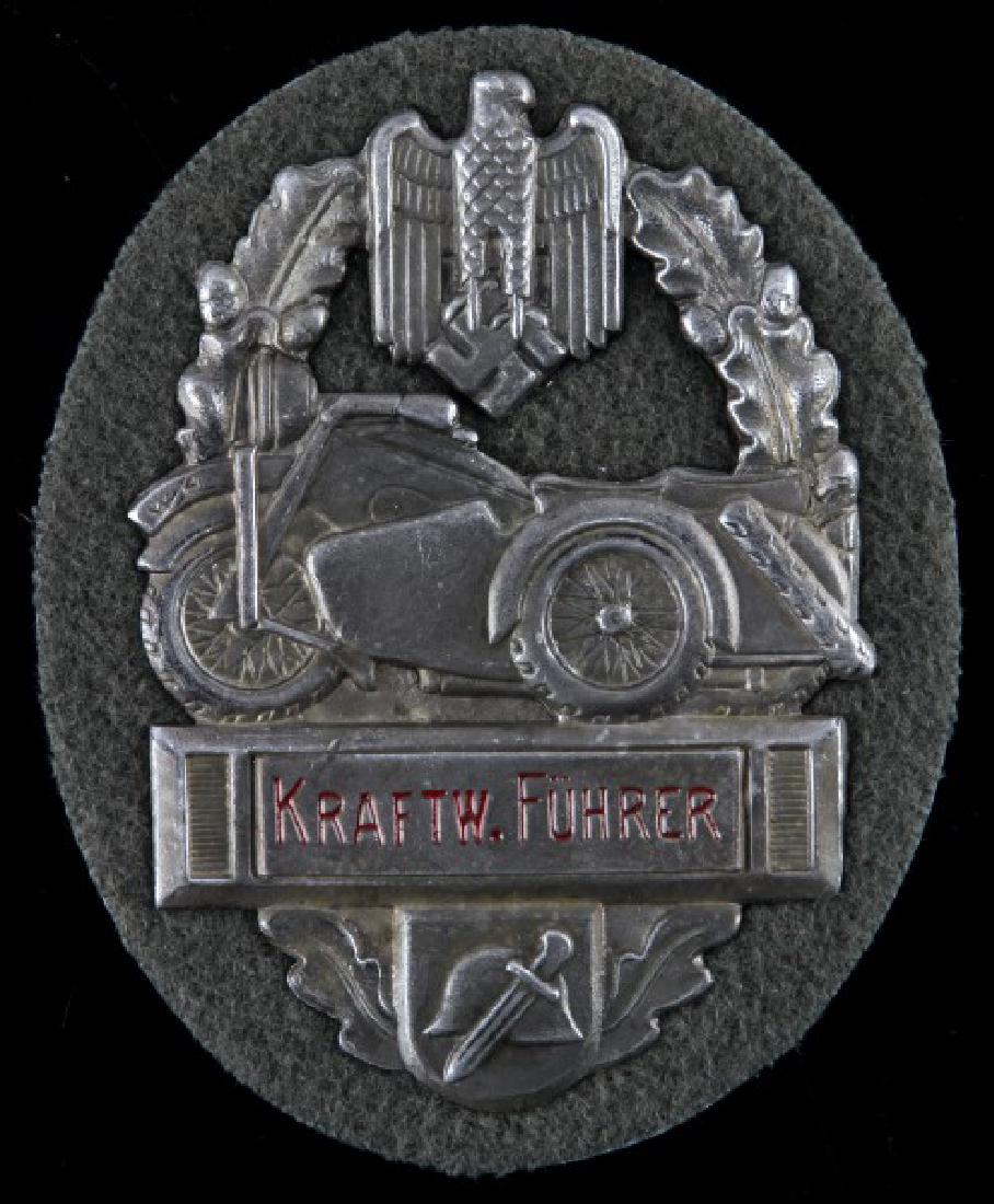 GERMAN WWII MILITARY BIKERS PLAQUE: "Kraftw. Fuhrer" 3" plaque (badge) on felt/fabric. Maker's mark and "63" on back. Some wear, good condition. Unauthenticated. Sold "as is". This lot has a reserve.