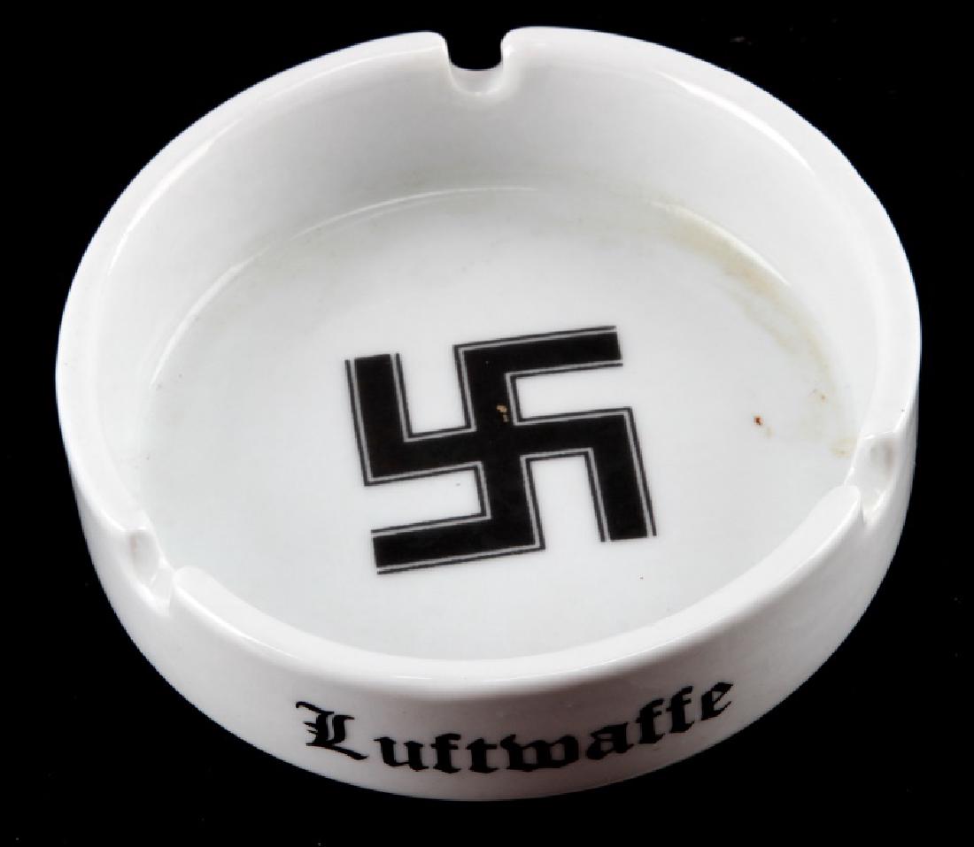 WWII GERMAN THIRD REICH ASHTRAY LUFTWAFFE SWASTIKA: 4" ashtray. Light wear present. Makers mark on underside "KPM FI. U.V." Eagle swastika. This lot has a reserve.