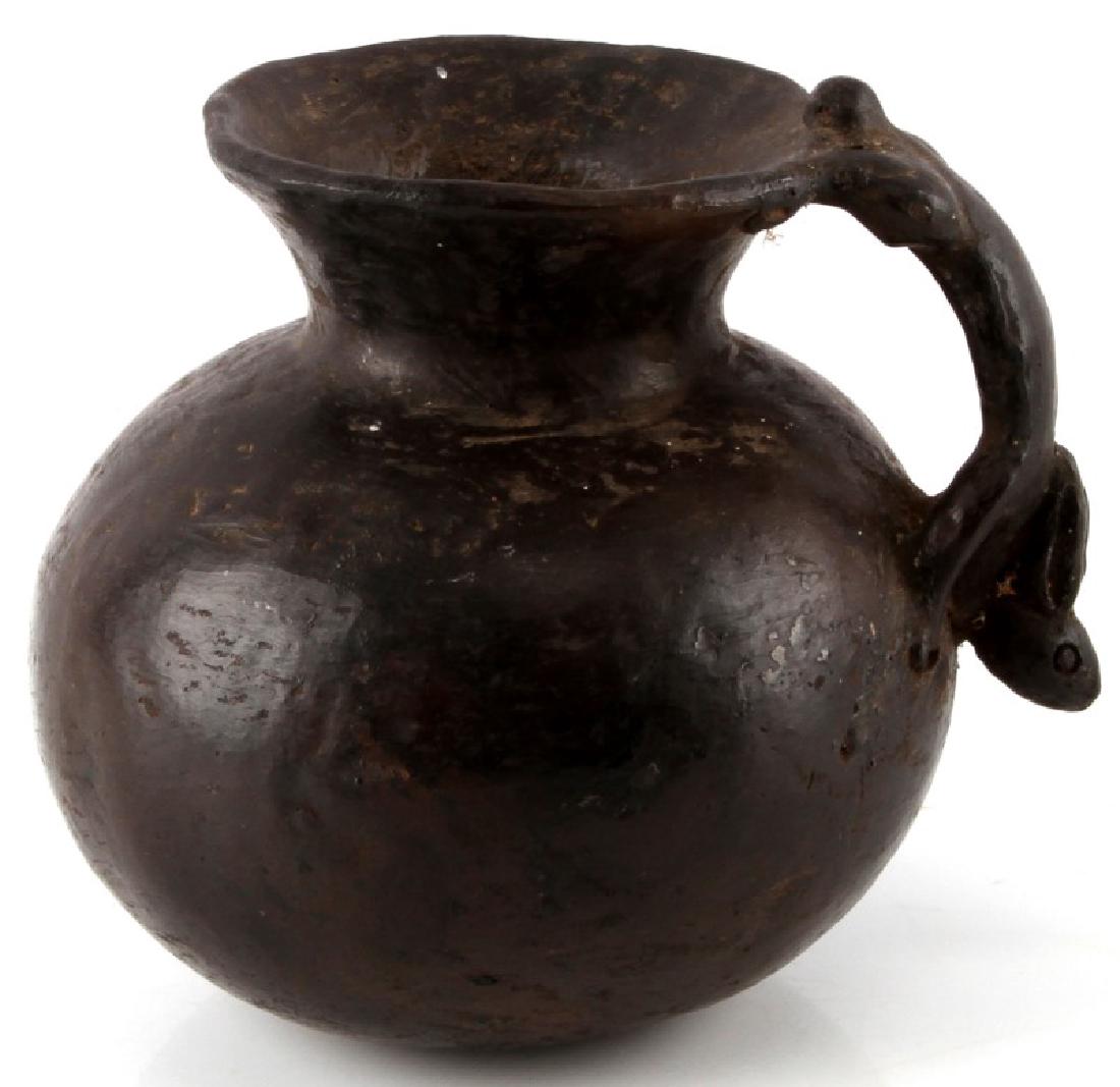 VINTAGE SEMINOLE RABBIT HANDLE CLAY EFFIGY VESSEL: Vintage or older Seminole tribe black clay pot/vessel. Measures approx. 5" tall x 5 1/2" at base. Simple design with rabbit handle. Some scuffs and wear add to the appearance. No other markings. Nice