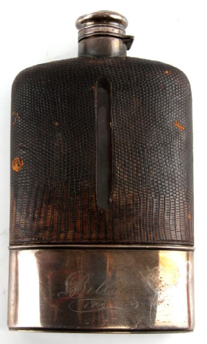 19TH CENTURY STERLING GORHAM SNAKE SKIN FLASK: Larger flask is 1/2 pint, Gorham with late 19th century hallmark and snake skin. Measures approximately 4" by 6 1/2". Marked "STERLING S2110 1/2 PINT". In very good condition.