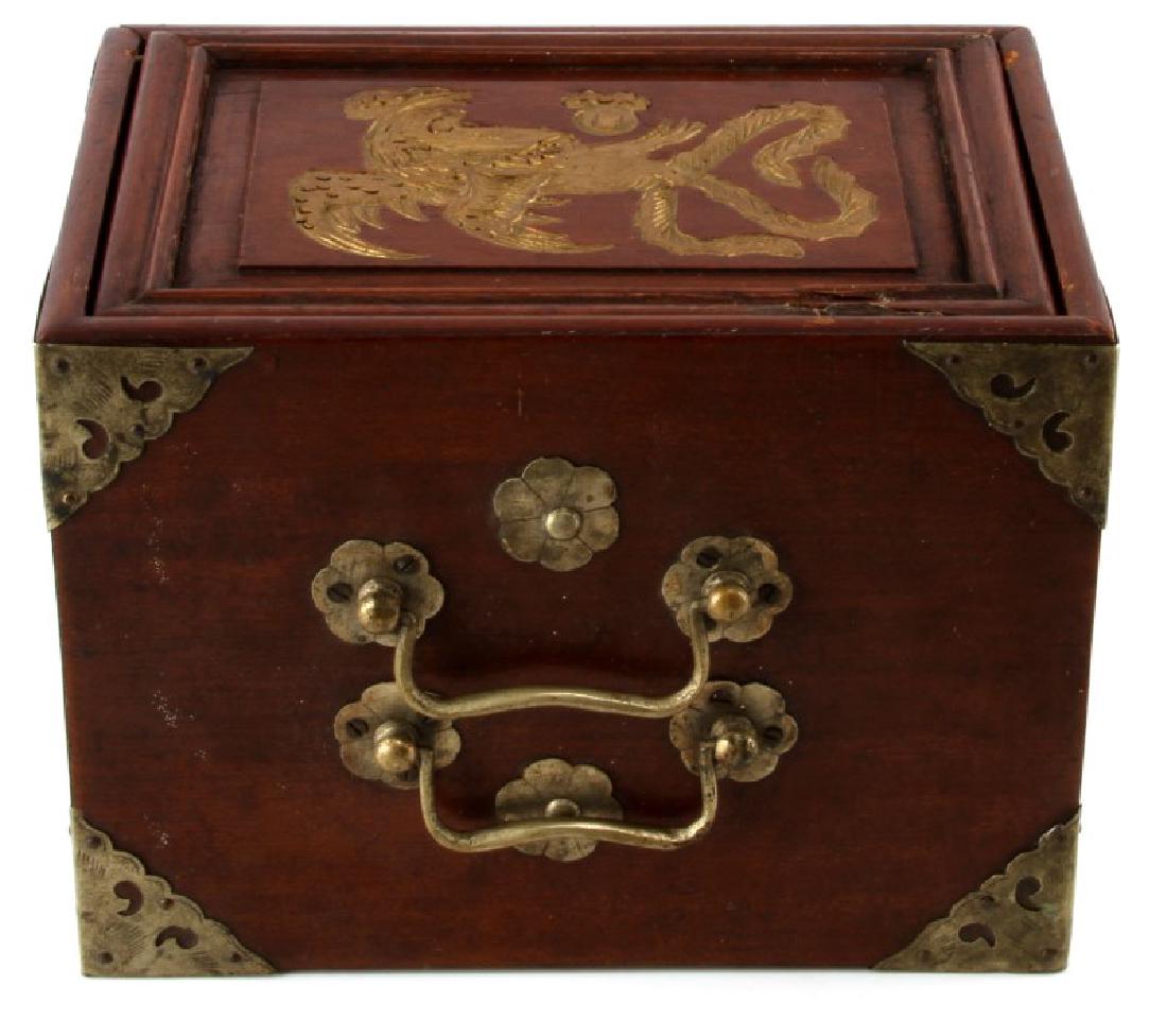 ANTIQUE CHINESE DRAGON MAHJONG SET BONE AND BAMBOO: Antique Chinese mahjong set. Box features a dragon design on cover plate. Pieces are constructed of bone and bamboo. Exterior of box displays brass features. 5 drawers. Measures 9 1/2" x 6 1/2" x 7". 