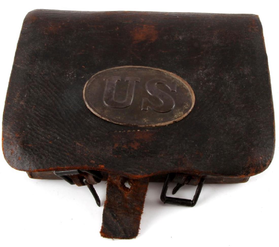 CIVIL WAR UNION BELT MOUNT CARTRIDGE CASE: Very good overall, leather remains supple, copper U.S. plate. C.S. Storms Maker N.Y. stamped on each side. Measures 8 by 6 inches.