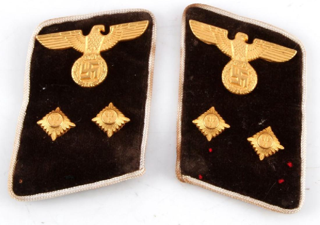WWII GERMAN NSDAP KREIS EXECUTIVE COLLAR TABS: WWII German NSDAP Kreis Executive collar tabs. Brown velvet with white silk piping and gilded insignia. Each measures 2.75 inches long. Some staining to piping, otherwise good condition. This lot has 