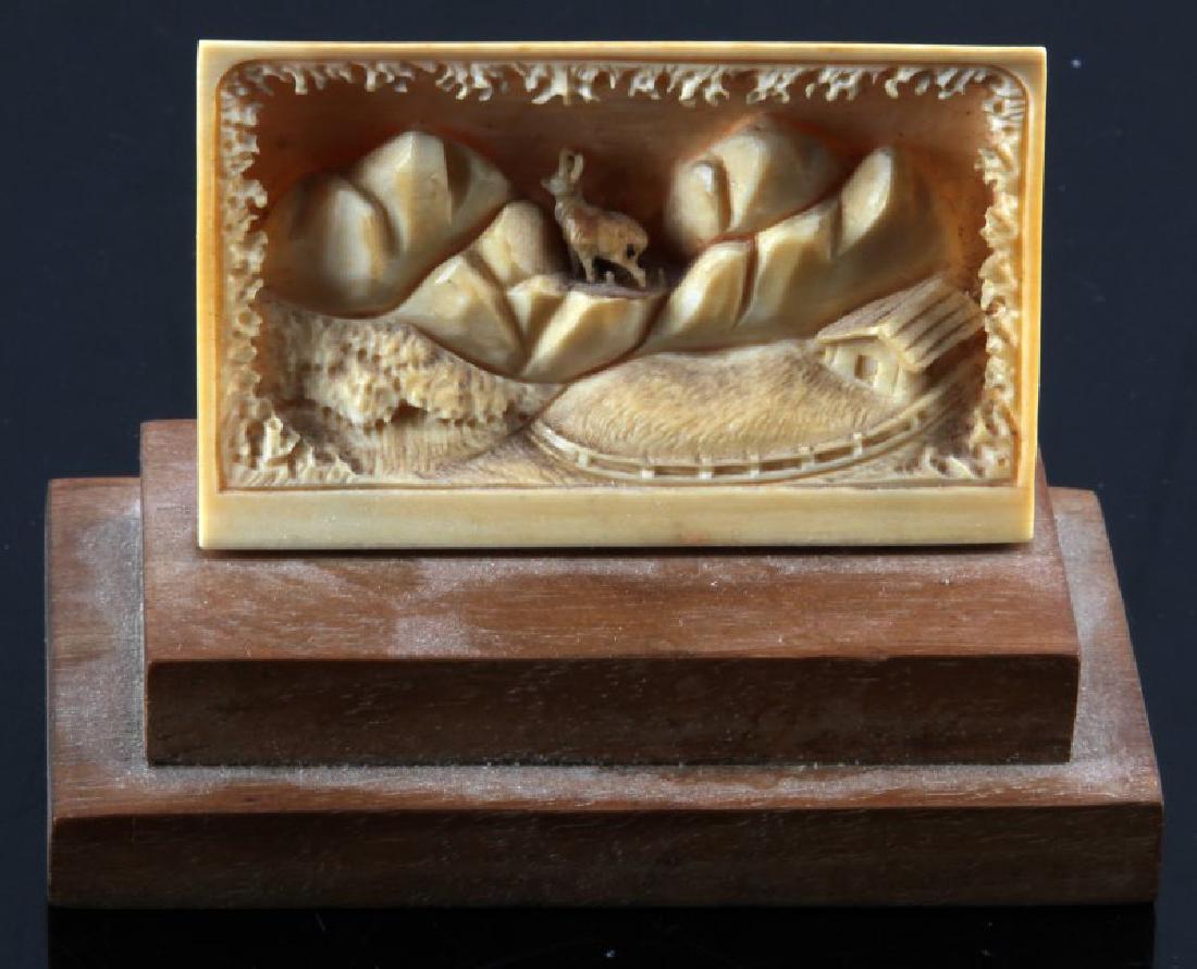 ANTIQUE FOSSIL WALRUS PRONG HORN SHEEP DIORAMA: Early 20th century, highly detailed mountain scene. With stand measures 10 by 8 cm.