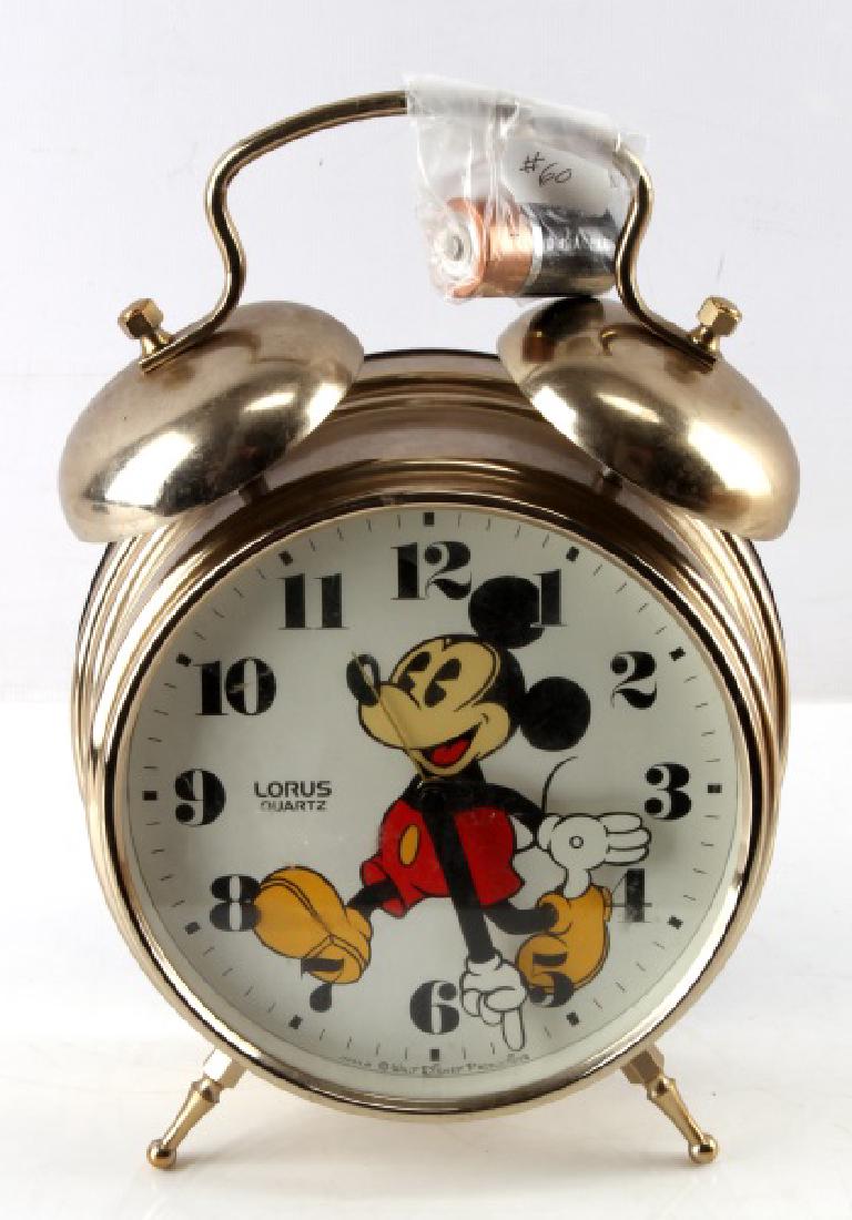 VINTAGE WALT DISNEY MICKEY MOUSE CLOCK: Bulova Mantel Clock. Keeps good time, battery included. Measures 6 1/2" across, and 11 1/2" tall. This lot has a reserve.