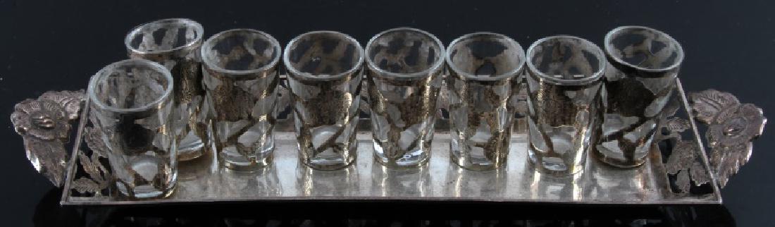 8 SILVER VINTAGE COMMUNION CUPS WITH SILVER TRAY: 8 sterling vintage silver wrapped glass communion cups. Comes with matching plate. Plate measures 11 1/2" by 2". Plate alone weighs 82.3 grams.