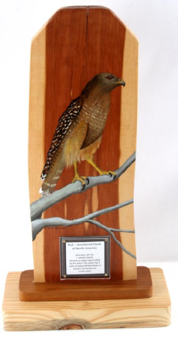 RED SHOULDERED HAWK J RANDY SMITH PAINTING CEDAR: Painting of a red-shouldered hawk on hand milled cedar. Measures approximately 10 1/2" by 20". In excellent condition by Tallahassee-based artist, J. Randy Smith. Please acquire third-party shipping e